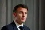 French President Emmanuel Macron looks on during a press conference at the end of the international conference aimed at strengthening Western support for Ukraine, at the Elysee presidential palace in Paris, on February 26, 2024. The meeting at the Elysee Palace will be a chance for participants to "reaffirm their unity as well as their determination to defeat the war of aggression waged by Russia in Ukraine", the French presidency said. (Photo by GONZALO FUENTES / POOL / AFP)