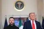 US President Donald Trump and Ukrainian President Volodymyr Zelensky stand for a family photo with European leaders in the Cross Hall of the White House in Washington, DC, on August 18, 2025. European leaders join Ukrainian President Volodymyr Zelensky in talks with US President Donald Trump on August 18, as they try to find a way to end Russia's offensive. The leaders heading to Washington on Monday to appear alongside Zelensky call themselves the "coalition of the willing." (Photo by ANDREW CABALLERO-REYNOLDS / AFP)